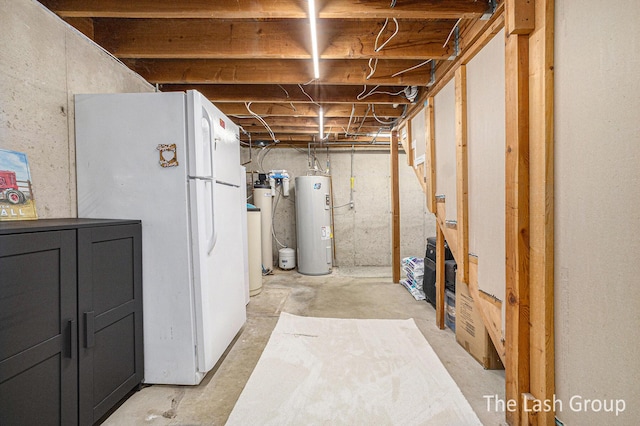 unfinished below grade area with freestanding refrigerator and electric water heater