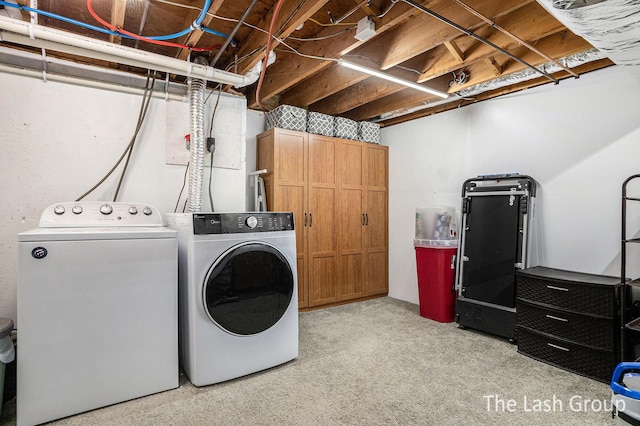 washroom with laundry area and independent washer and dryer