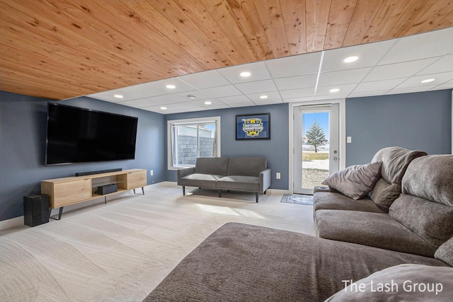 living room with recessed lighting, carpet flooring, and baseboards