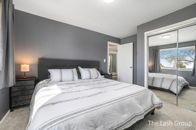 carpeted bedroom with a closet