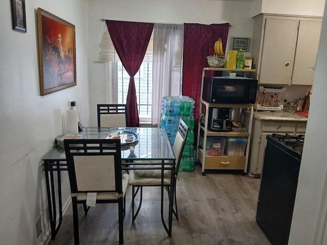 dining area with wood finished floors