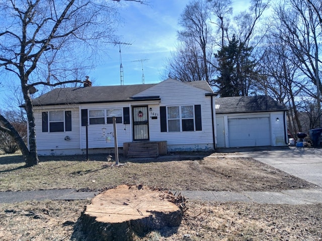 view of front of property featuring an attached garage, a chimney, and driveway