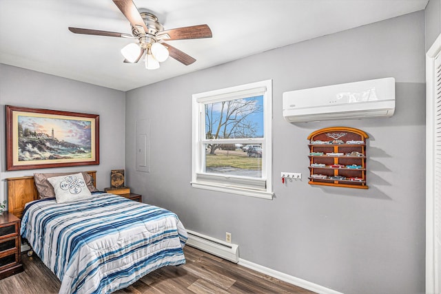 bedroom featuring wood finished floors, baseboards, a wall mounted AC, ceiling fan, and baseboard heating