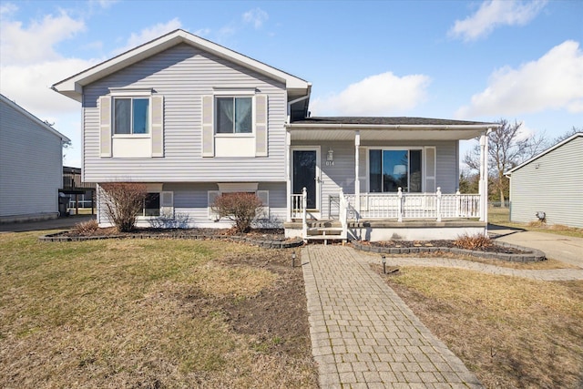 split level home featuring a front lawn and a porch