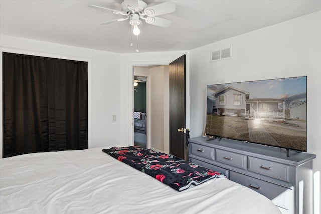 bedroom featuring ceiling fan and visible vents