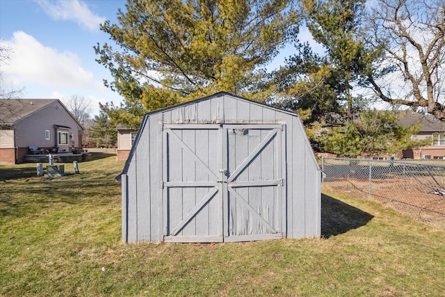 view of shed with fence