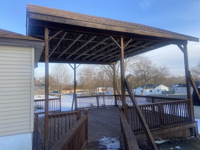 wooden terrace featuring fence