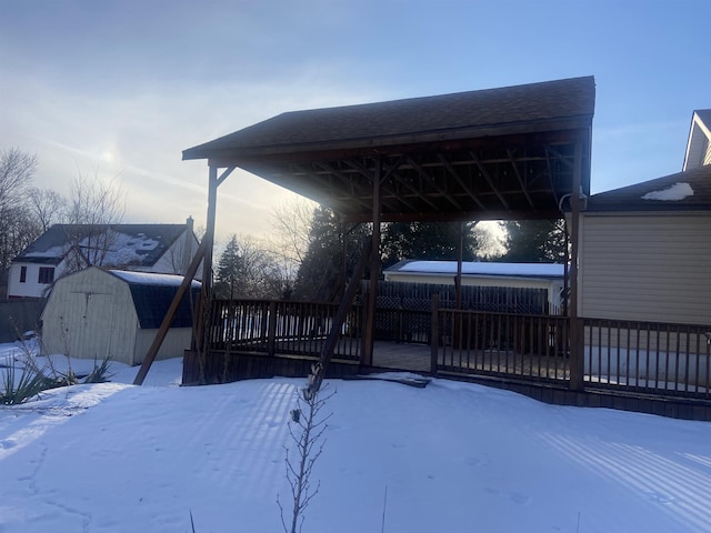 exterior space featuring an outdoor structure, a storage shed, and fence