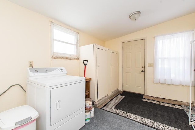 laundry room featuring washer / dryer and laundry area