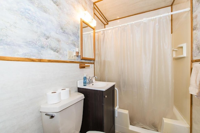 full bathroom featuring toilet, shower / bath combination with curtain, and vanity