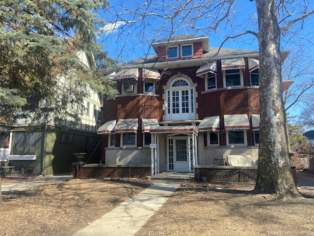 view of front of house featuring brick siding