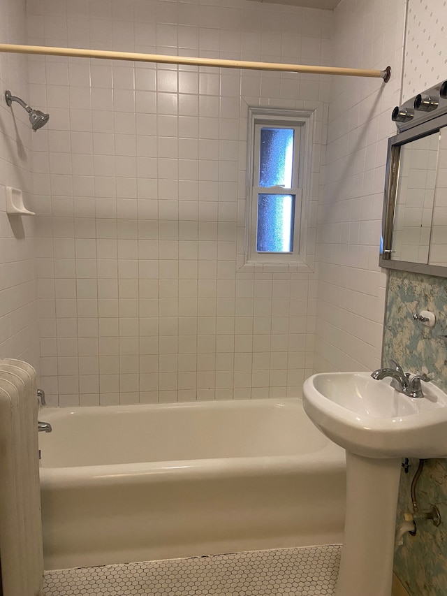 bathroom featuring tile patterned flooring and bathing tub / shower combination