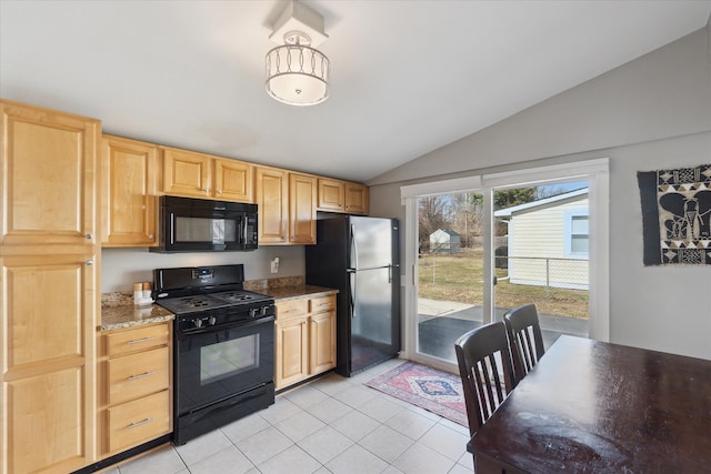 kitchen with black appliances, light tile patterned floors, light brown cabinets, and vaulted ceiling