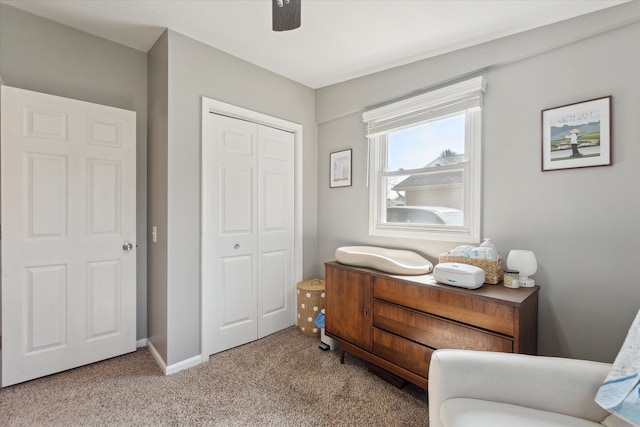 interior space featuring carpet flooring, ceiling fan, and baseboards