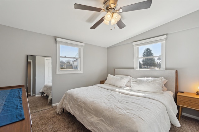 bedroom with multiple windows, carpet floors, ceiling fan, and vaulted ceiling