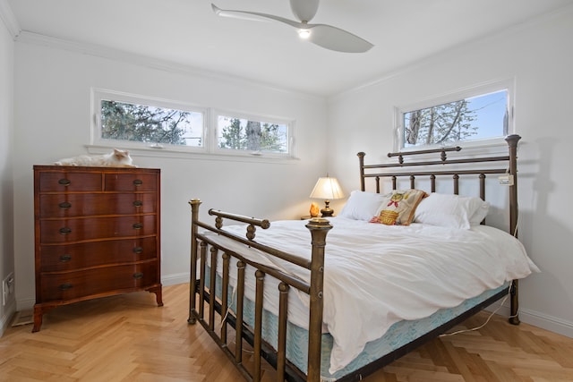 bedroom with ceiling fan, baseboards, and ornamental molding