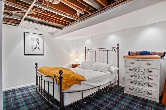 carpeted bedroom featuring baseboards