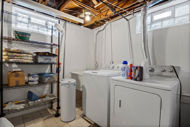 laundry room with separate washer and dryer and laundry area