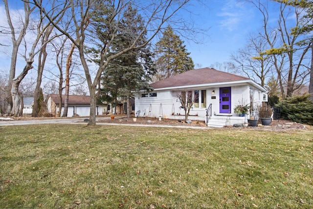 view of front of property with a front lawn and brick siding