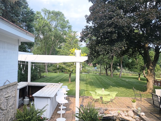 view of yard with outdoor dining area and a patio