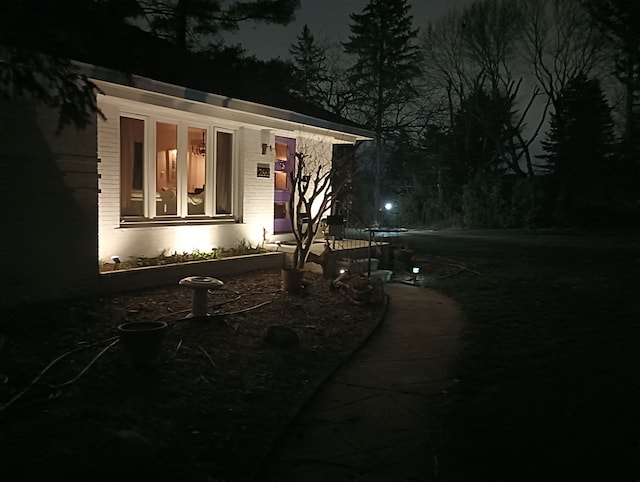 view of property exterior at twilight