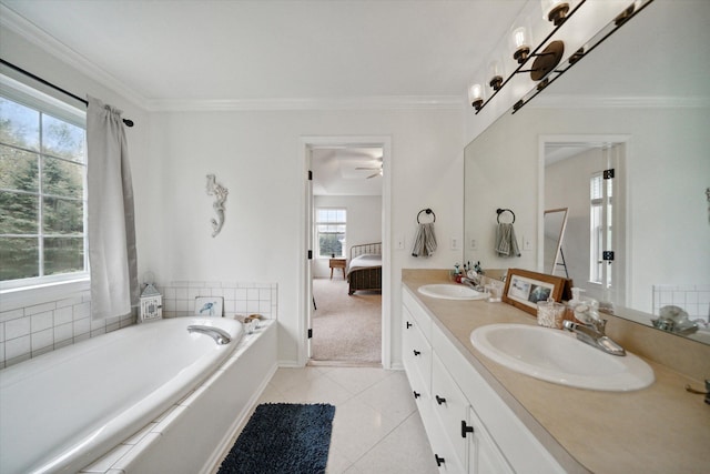 ensuite bathroom with ornamental molding, a sink, ensuite bath, and a bath