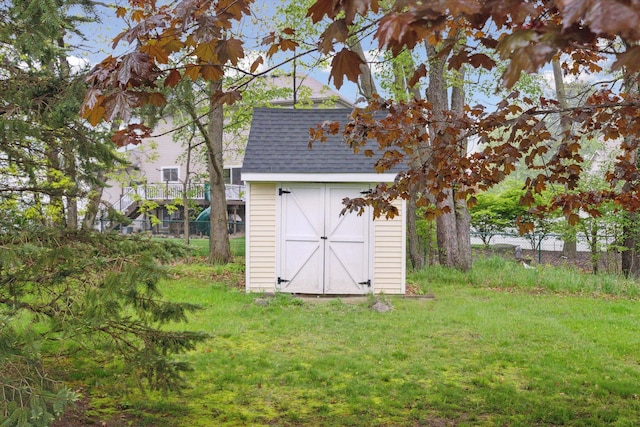 view of shed featuring fence