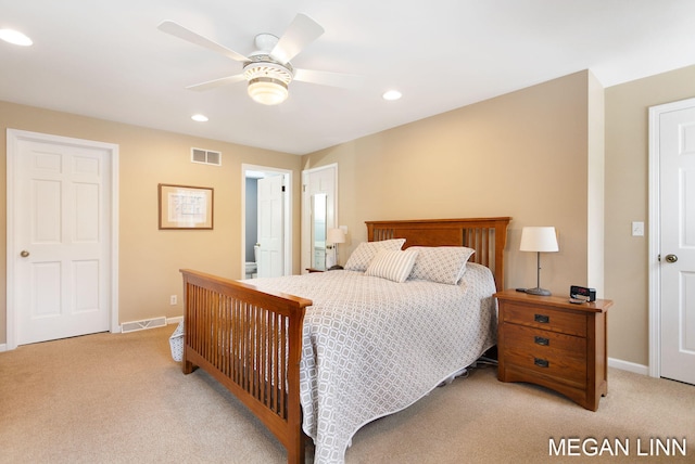 bedroom with light carpet, baseboards, and visible vents