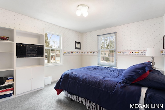 carpeted bedroom featuring wallpapered walls