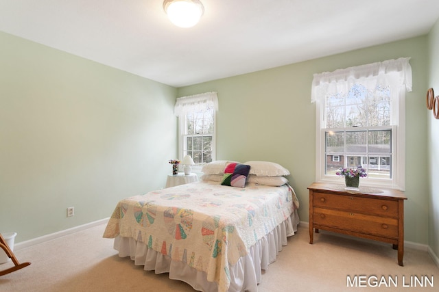 bedroom featuring carpet flooring and baseboards