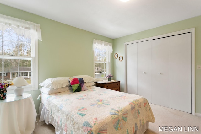 bedroom featuring a closet and carpet flooring