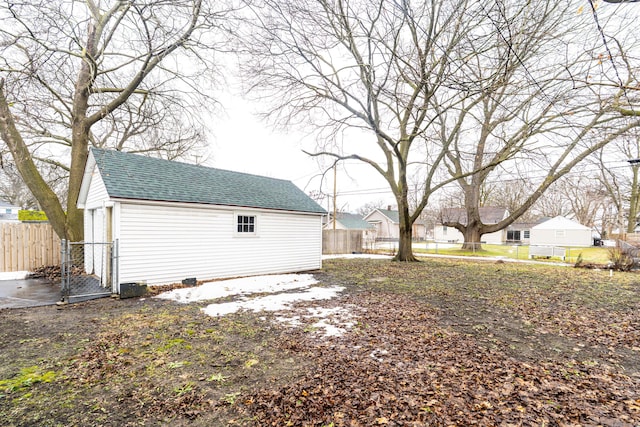 view of yard featuring an outbuilding and fence private yard