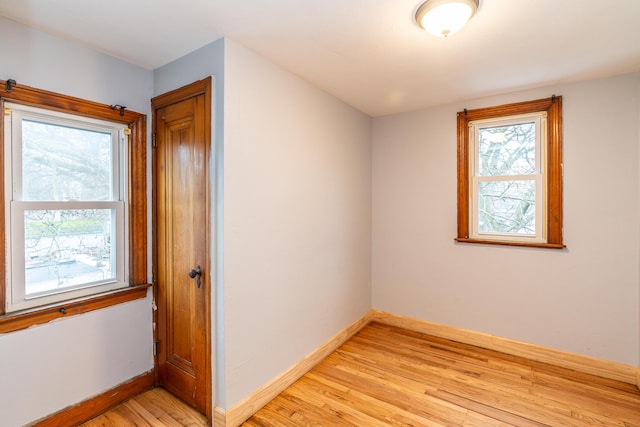 interior space with light wood-type flooring and baseboards