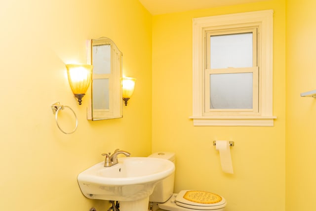 bathroom with a sink and toilet