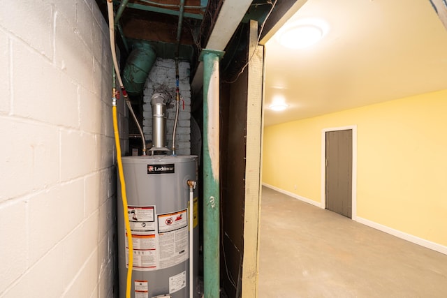 utility room featuring water heater