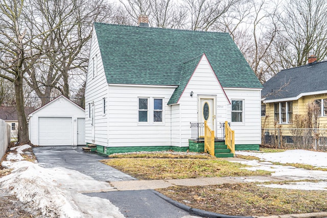 view of front of house featuring a garage, a chimney, roof with shingles, an outbuilding, and fence