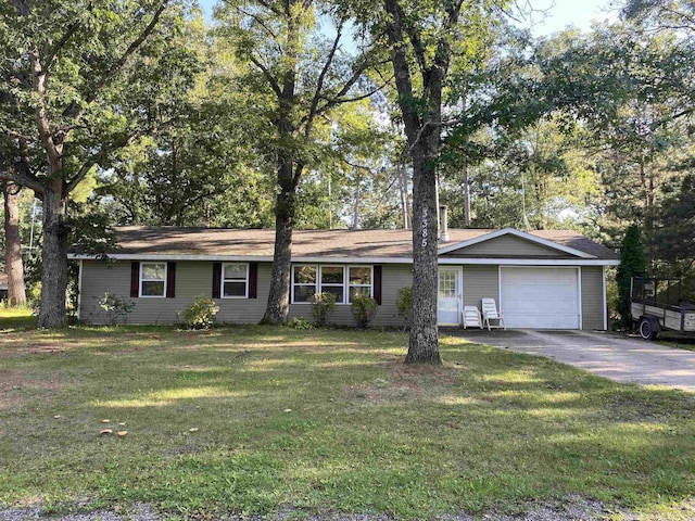 single story home featuring an attached garage, driveway, and a front lawn