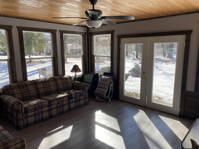 sunroom / solarium featuring wood ceiling and french doors