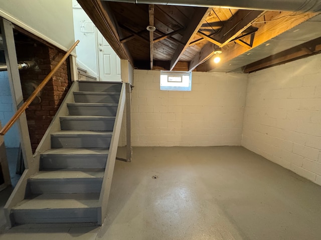 basement featuring stairs