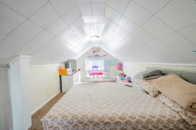 carpeted bedroom featuring lofted ceiling