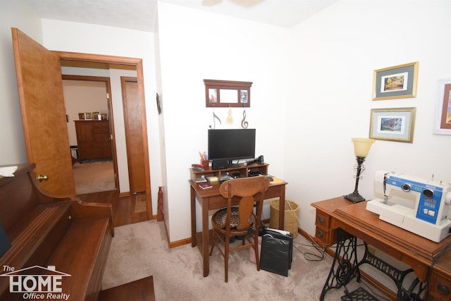 carpeted office with baseboards