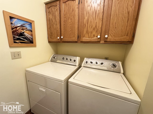 laundry area with cabinet space and washer and dryer