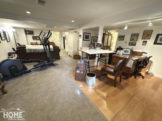 interior space with recessed lighting, visible vents, light wood-style flooring, and baseboards