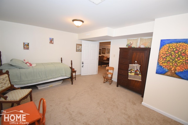 carpeted bedroom with baseboards