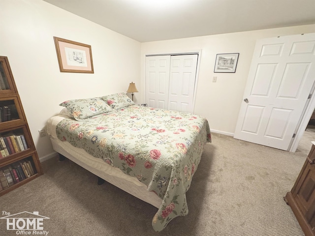 bedroom featuring carpet floors, a closet, and baseboards