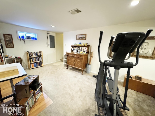 workout room with recessed lighting, carpet floors, visible vents, baseboards, and electric panel