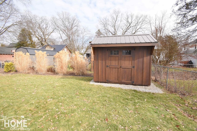 view of shed with fence