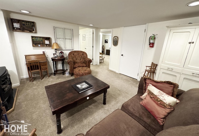 living area featuring carpet, baseboards, and recessed lighting