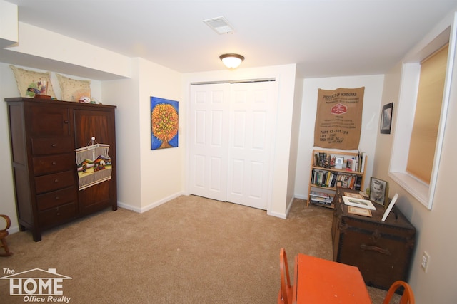 living area with light carpet, visible vents, and baseboards