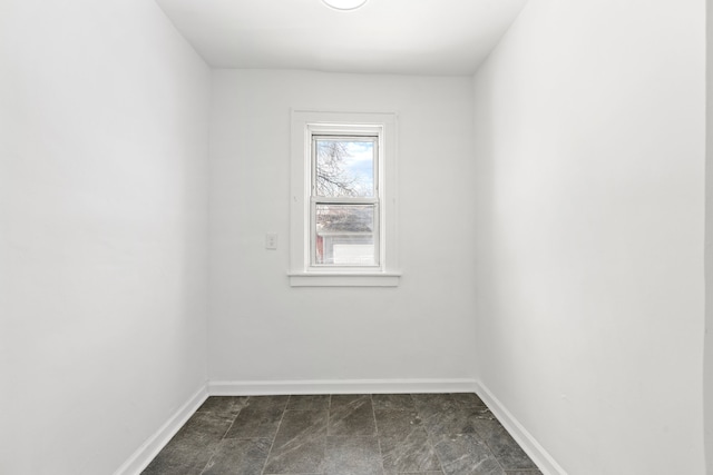 empty room with baseboards